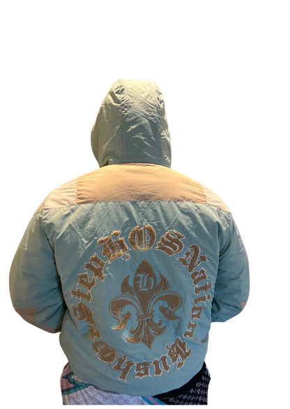 Light blue jacket with 'Hush or Step Nation' logo on the back, worn by a person against a white background.